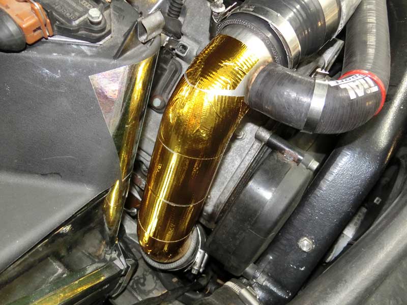 DEI Reflect-A-Gold tape wrapped TiAL inlet pipe